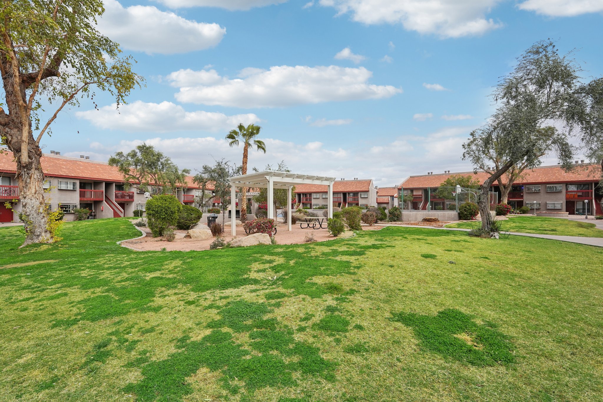 Mature trees and building exteriors at Woodstream Village